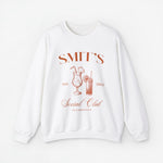 Witte gepersonaliseerde sweater met 'SMIT'S Social Club' print op de borst