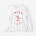 Witte sweatshirt met ronde hals en koperkleurige feestprint voorop
