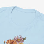 Lichtblauw t-shirt met ronde hals en gedeeltelijke bloemenprint