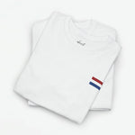 Wit T-shirt (oversized) met vlagprint in rood-wit-blauw op de borst, opgevouwen