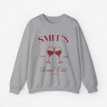 Grijze sweatshirt met rode opdruk SMIT'S Social Club, twee wijnglazen en jaartal 2021.