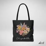 Zwarte tote bag met kleurrijke bloemenprint en naam Elizabeth, grote voorzijde.