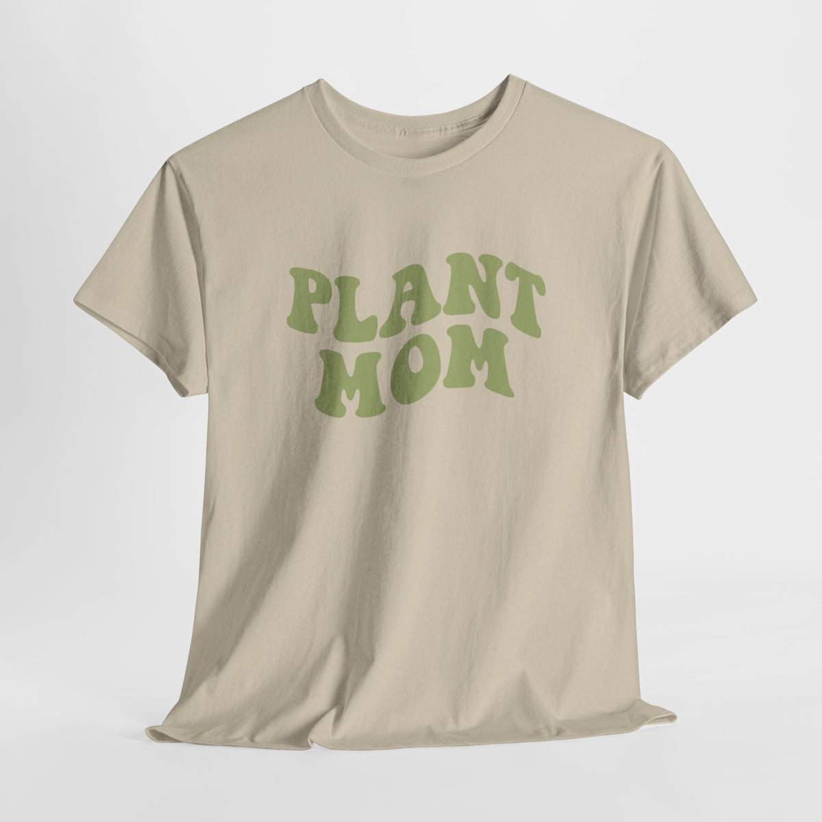 Beige T-shirt met groene “PLANT MOM” print op de borst, korte mouwen.