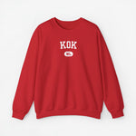 Sweater met ronde hals in rood en borstprint “KOK”