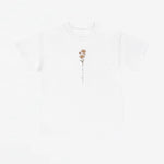 Wit T-shirt met ronde hals en kleine bloemprint met slingerende tekstlijn