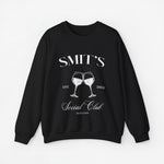 Zwarte sweatshirt met witte opdruk SMIT'S Social Club en twee wijnglazen, jaartal 2024.