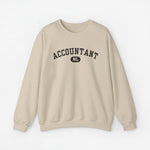 Beigetint trui met opdruk 'ACCOUNTANT' en rond logo 'NL'.