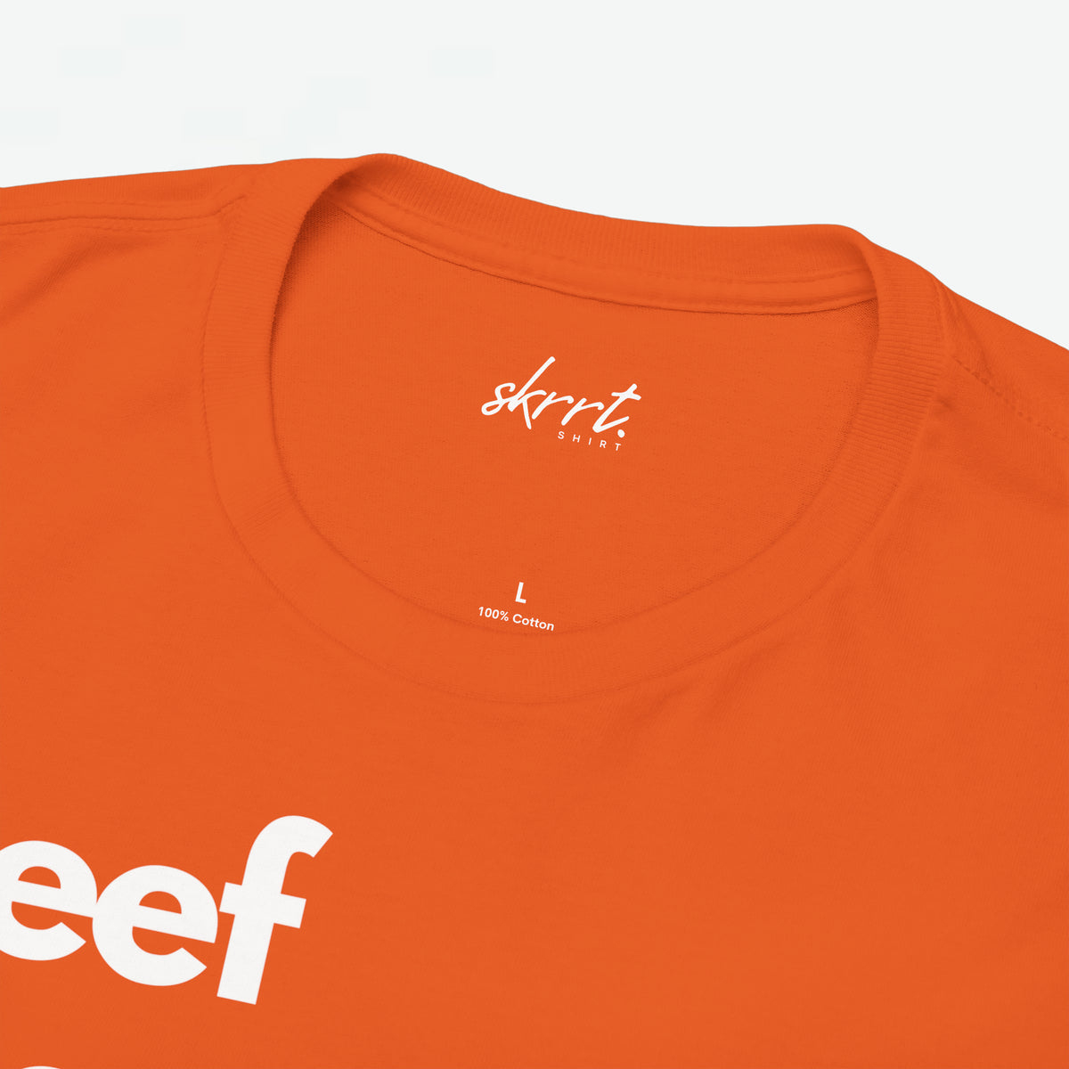 Oranje t-shirt met ronde hals; kleine merkprint en '100% cotton' in nek