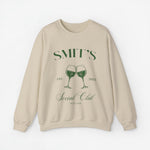 Beige sweater met opdruk “SMIT’S Social Club Zeeland 2024” en wijnglazen.