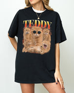 Zwart t-shirt met grote kattenfoto-print in oranje en goudtinten.